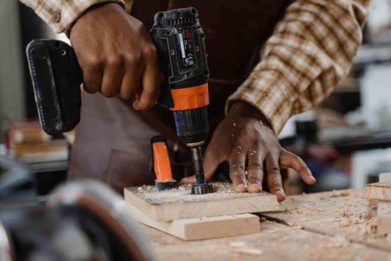 Carpenter Using An Impact Driver On A Single Wood