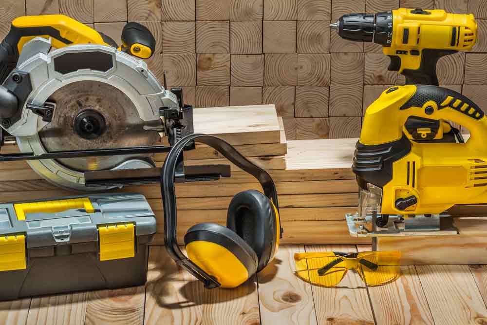 Electric Hand Tools On Wooden Background